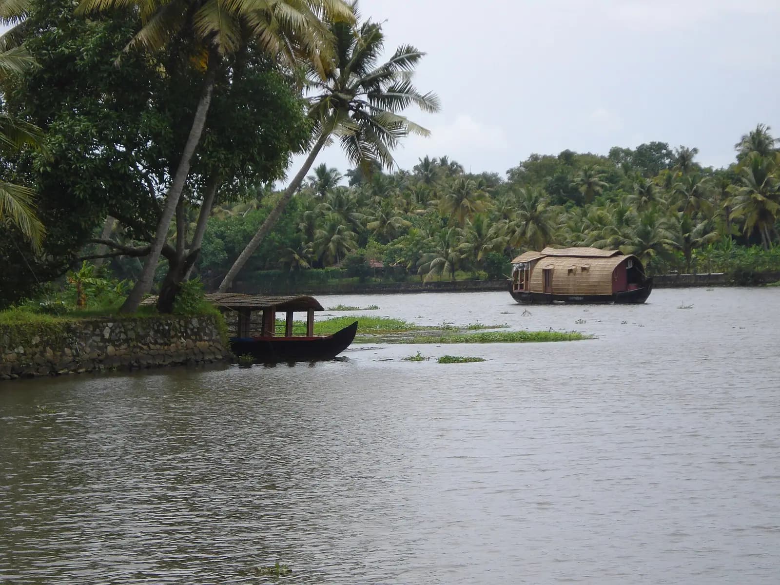 A thatched kettuvallam houseboat on the Alappuzha backwaters in Kerala