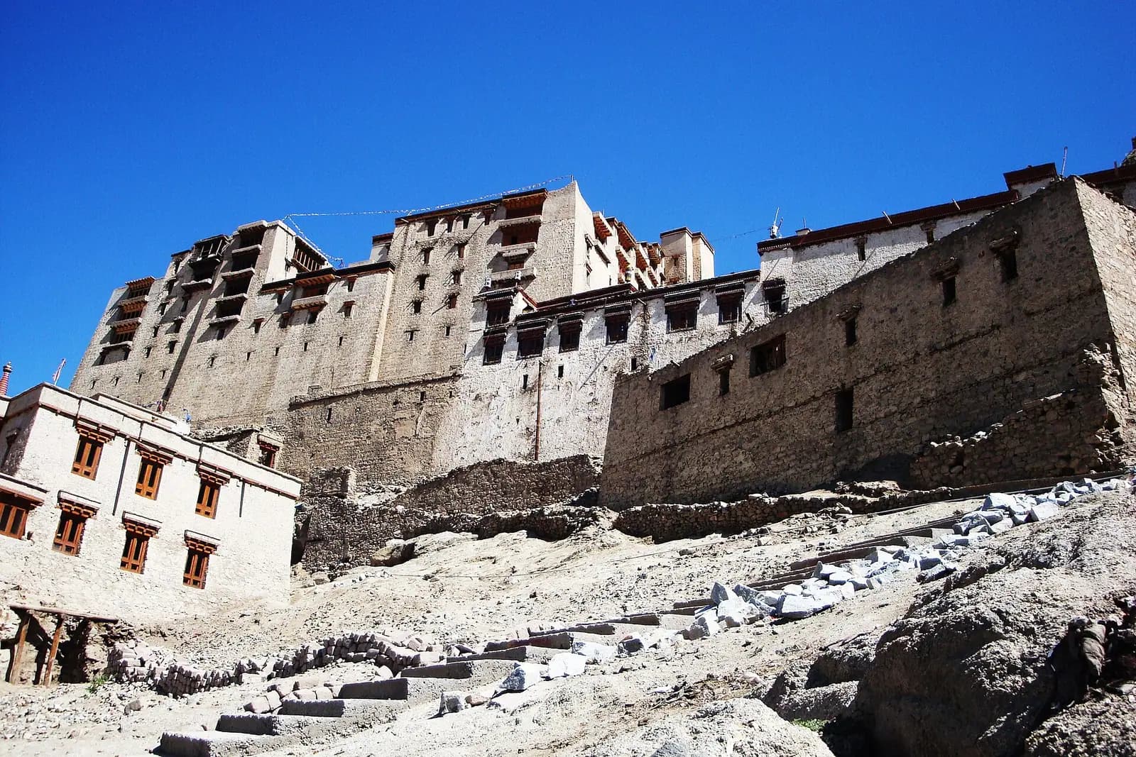 The tiered stone mass of Leh Palace above the old town in Ladakh