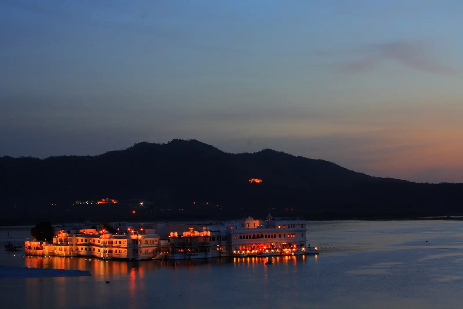 The Lake Palace lit up on Lake Pichola after sunset, Udaipur, Rajasthan