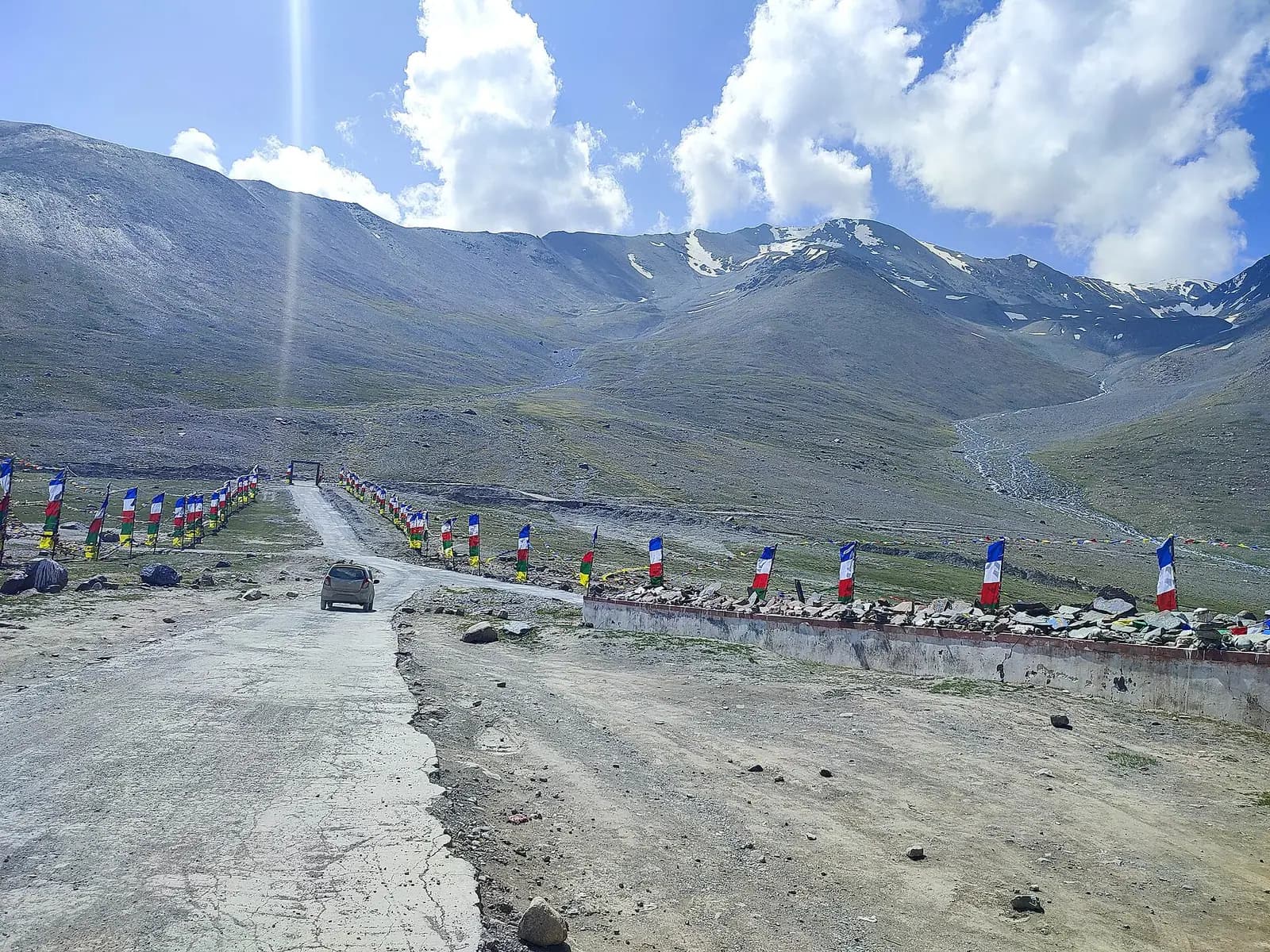 The road over Kunzum Pass lined with prayer flags, between Lahaul and Spiti