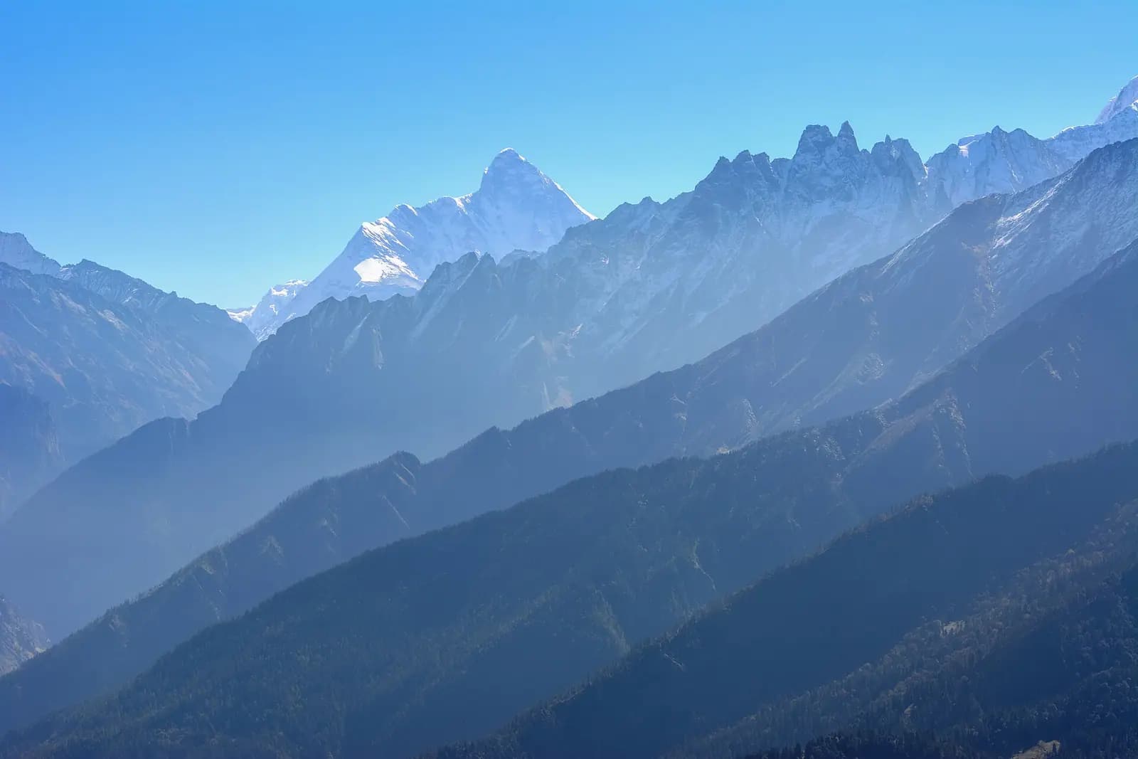 The summit of Nanda Devi seen across the ranges from Auli, Uttarakhand
