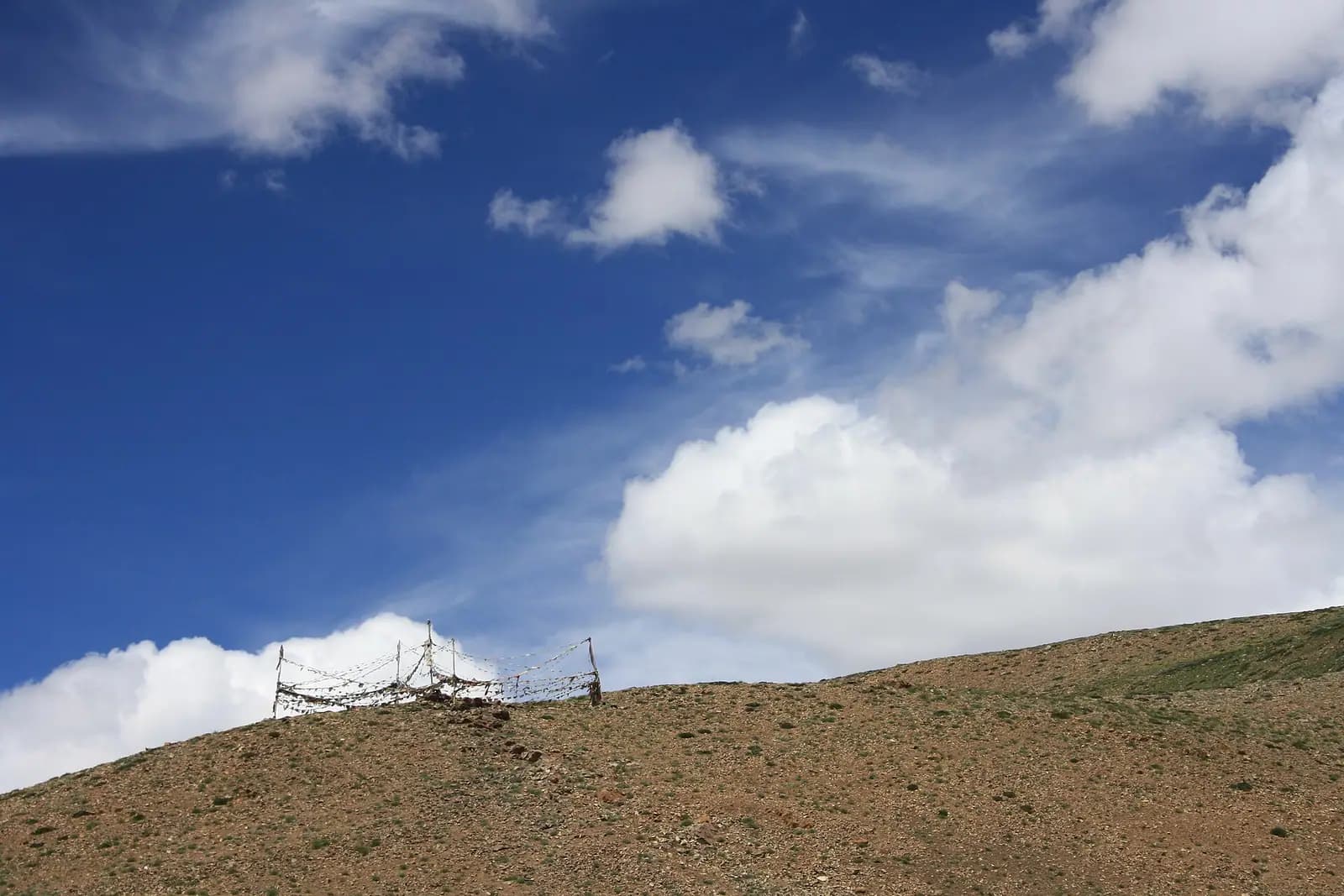 A Buddhist monastery with prayer flags in Himachal Pradesh