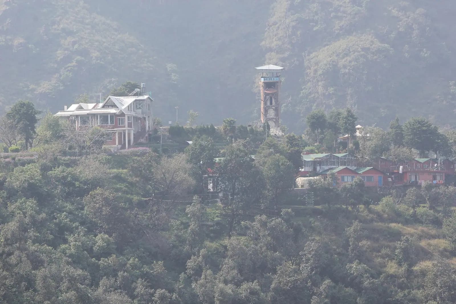 Houses stacked along the ridge at Mussoorie above the Doon valley, Uttarakhand