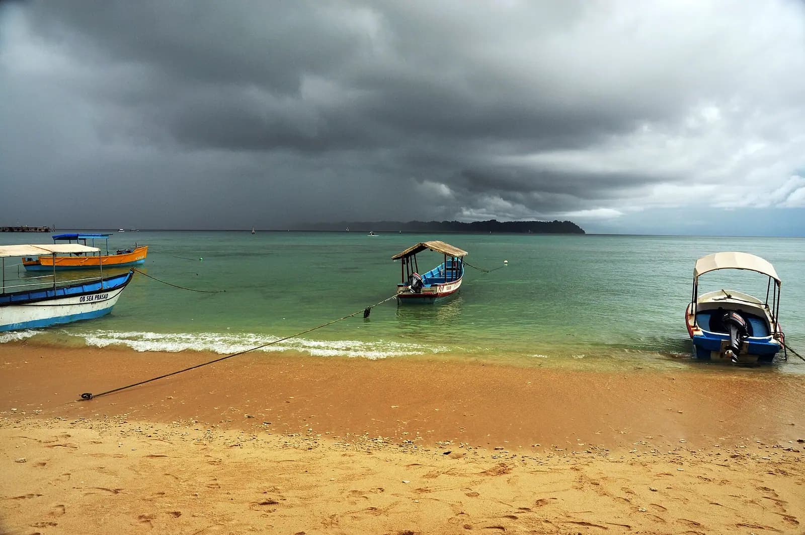 Boats moored off Bharatpur beach on Neil Island, Andaman Islands