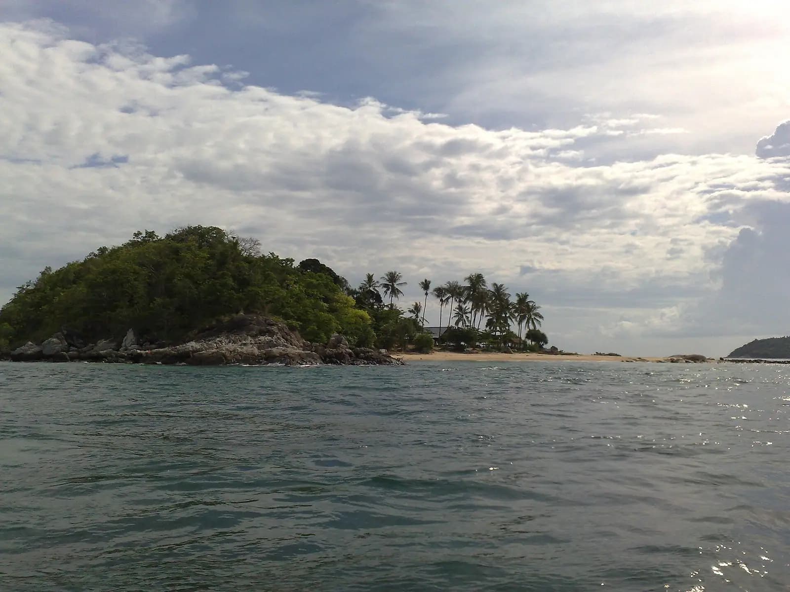 Forested headlands and turquoise sea from a Phuket viewpoint, Thailand