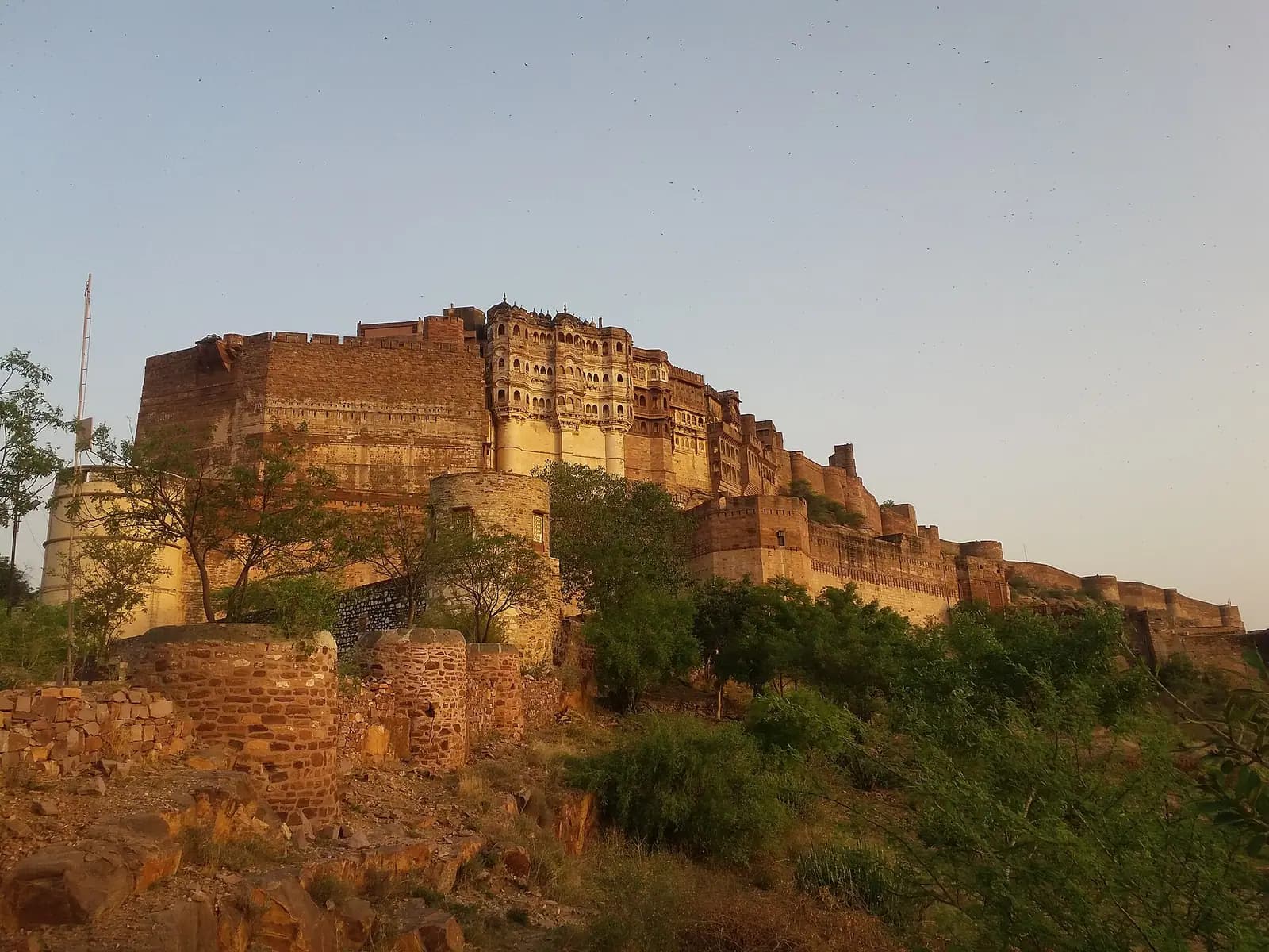 Mehrangarh Fort catching the evening light on its rock above Jodhpur, Rajasthan