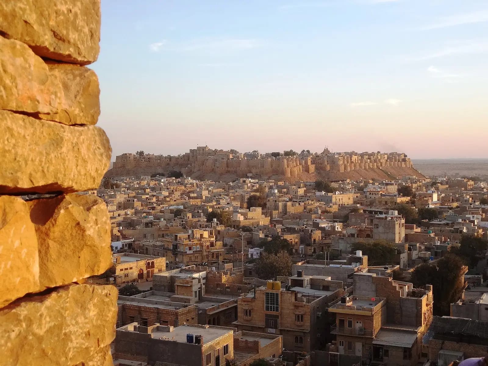 Jaisalmer's golden fort seen across the rooftops of the old town, Rajasthan