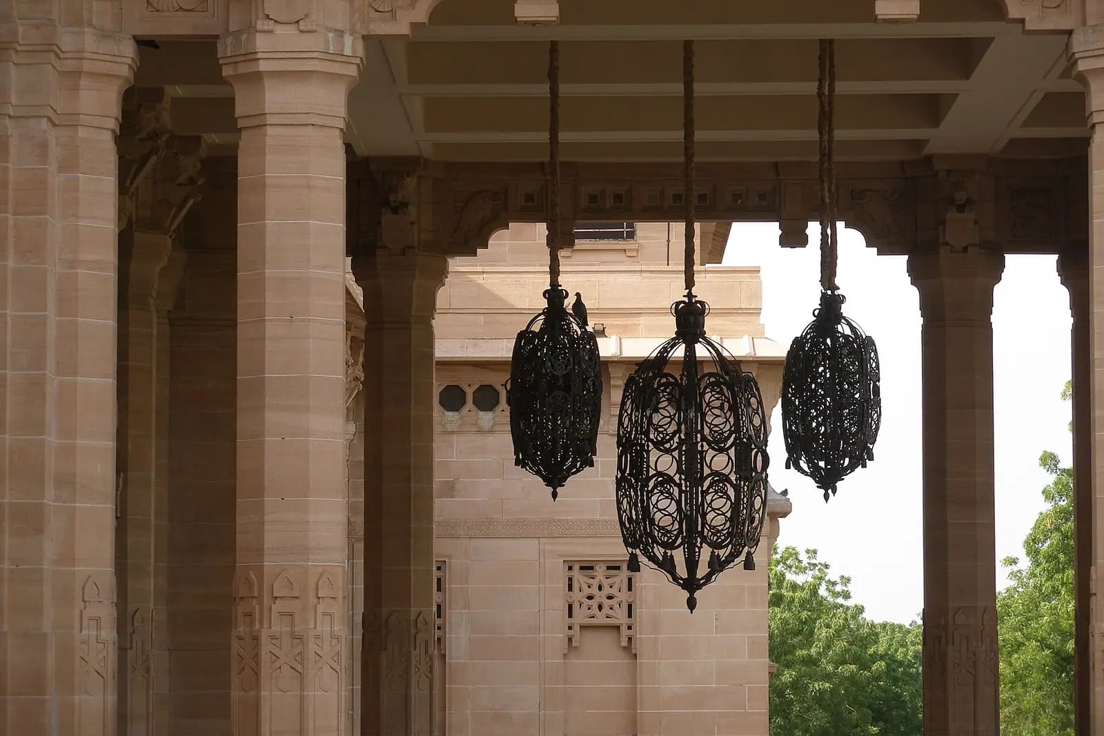 Sandstone colonnade and hanging lanterns at Umaid Bhawan Palace, Jodhpur, Rajasthan