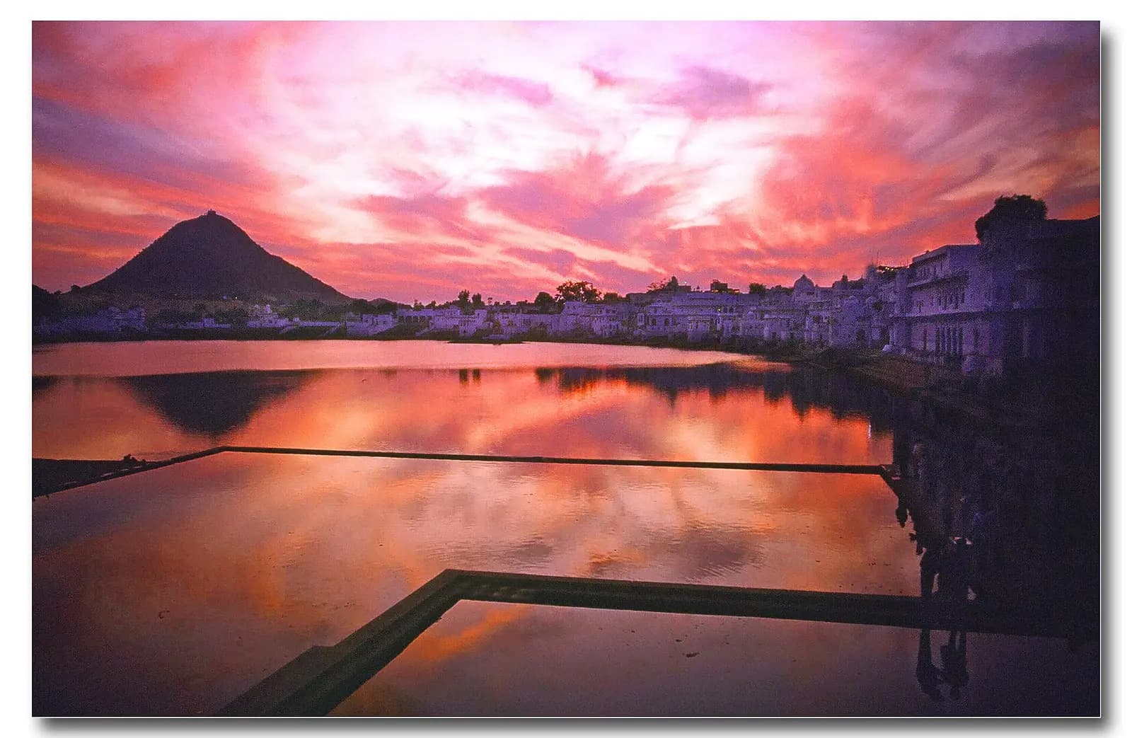 White temple town of Pushkar spread below the Aravalli hills, Rajasthan